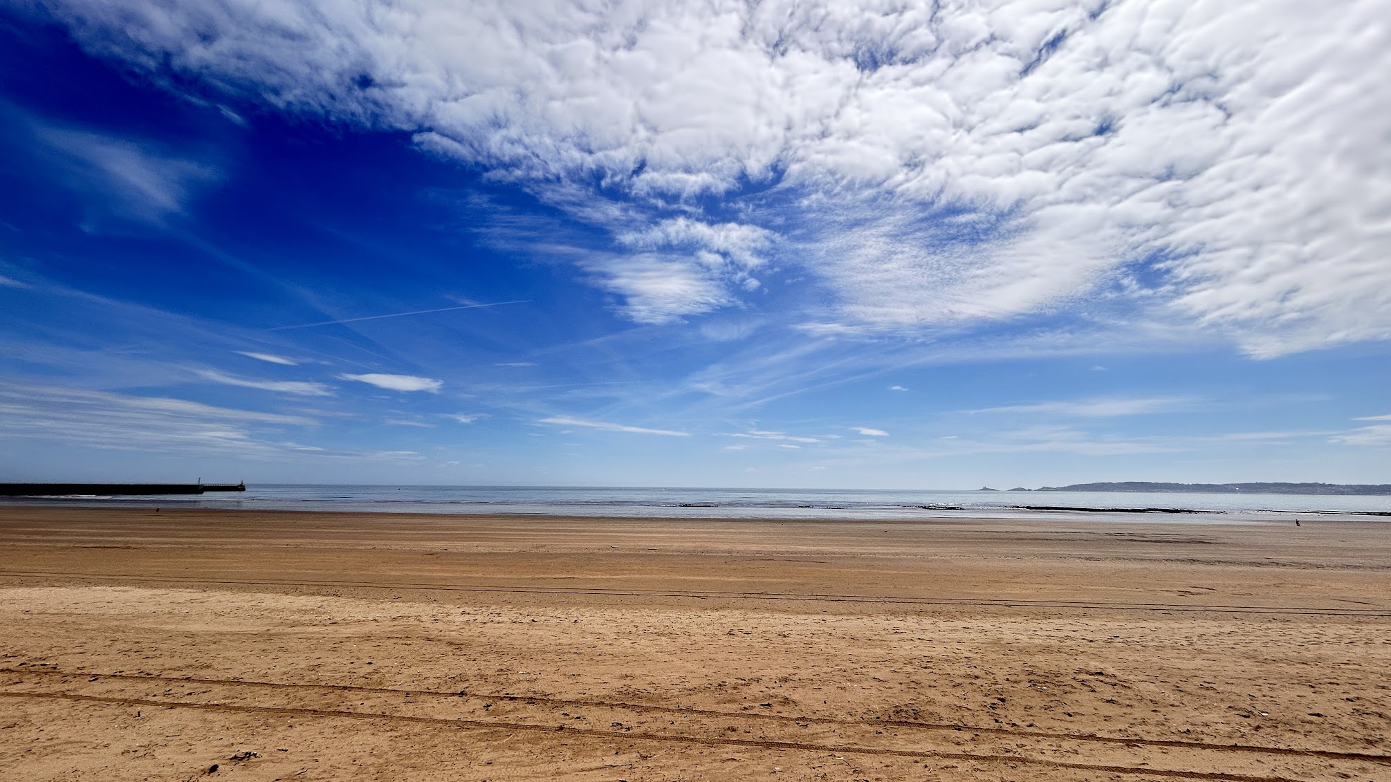 Swansea Bay at the Maritime Quarter - open sand, low tide and a wide cloud sky